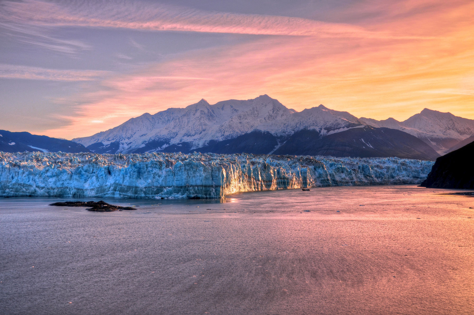 Alaska glacier and mountain landscape at sunset
