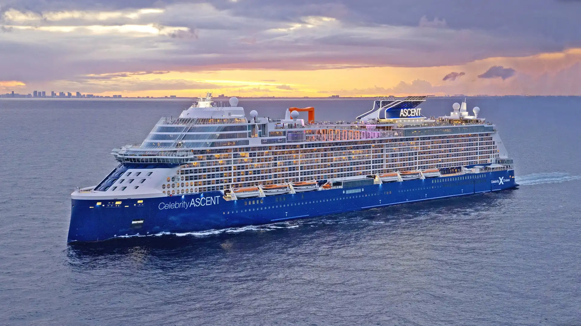 Celebrity Ascent sailing at sea near sunset